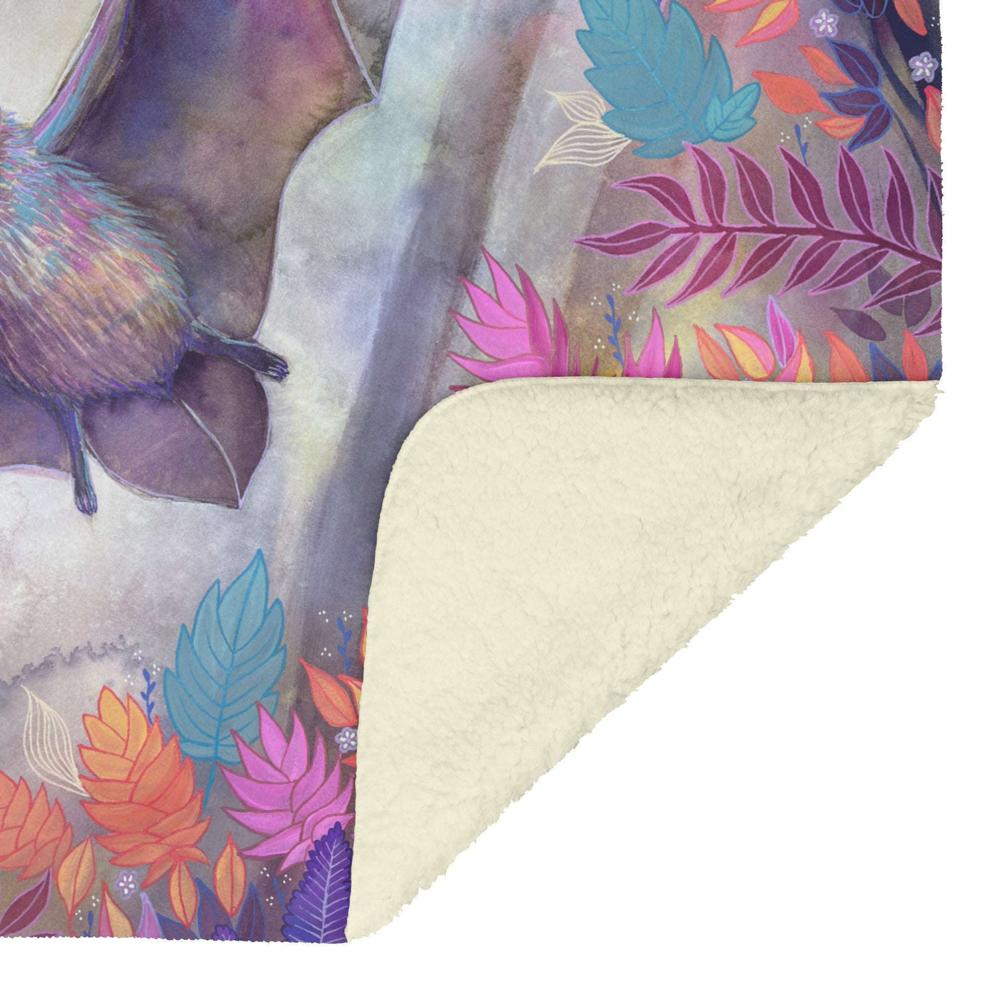 Colorful floral pattern on a Bat Blanket with a soft, white sherpa underside, partially folded to reveal texture.