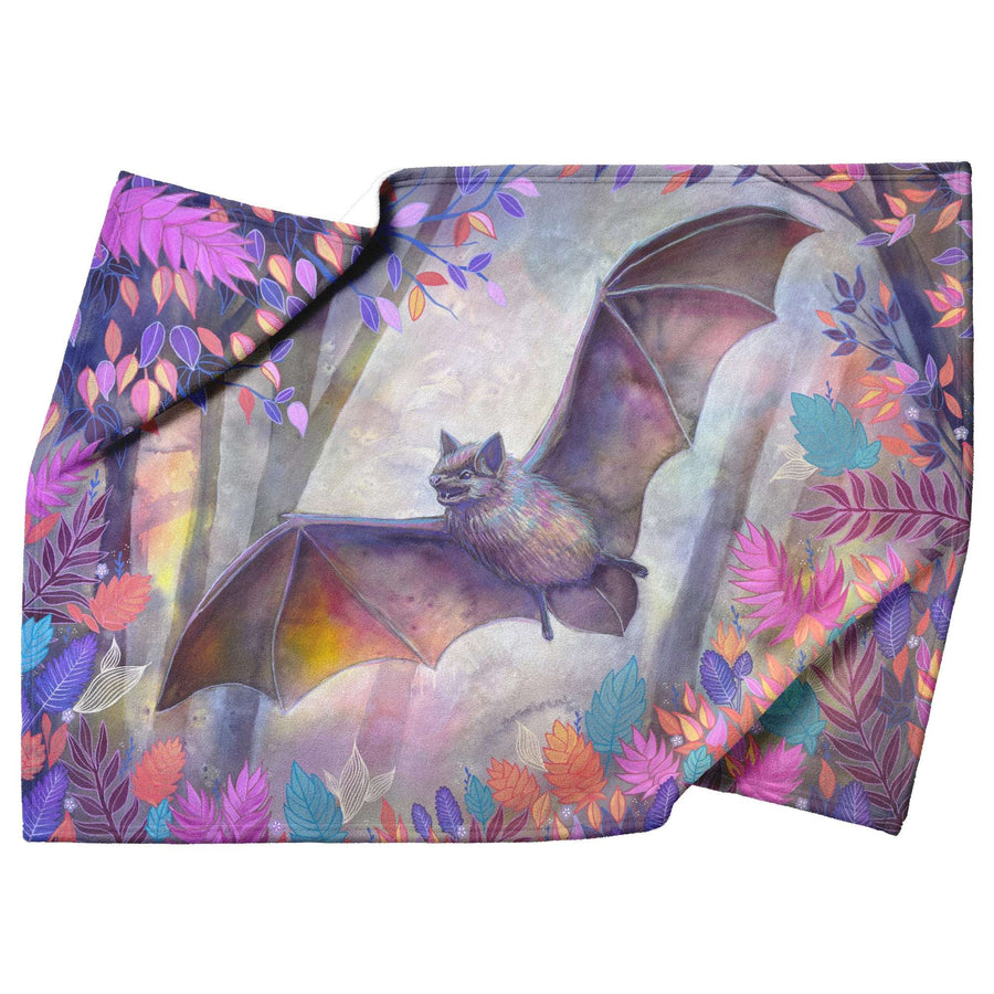 Bat Blanket featuring a colorful illustration of a bat surrounded by vibrant, multi-colored leaves.