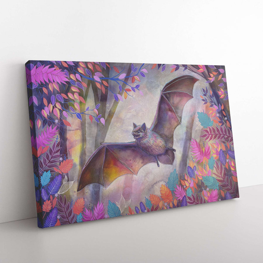 A Canvas Bat Print depicting a whimsical illustration of a bat flying among vibrant, colorful foliage, displayed on a white wall.
