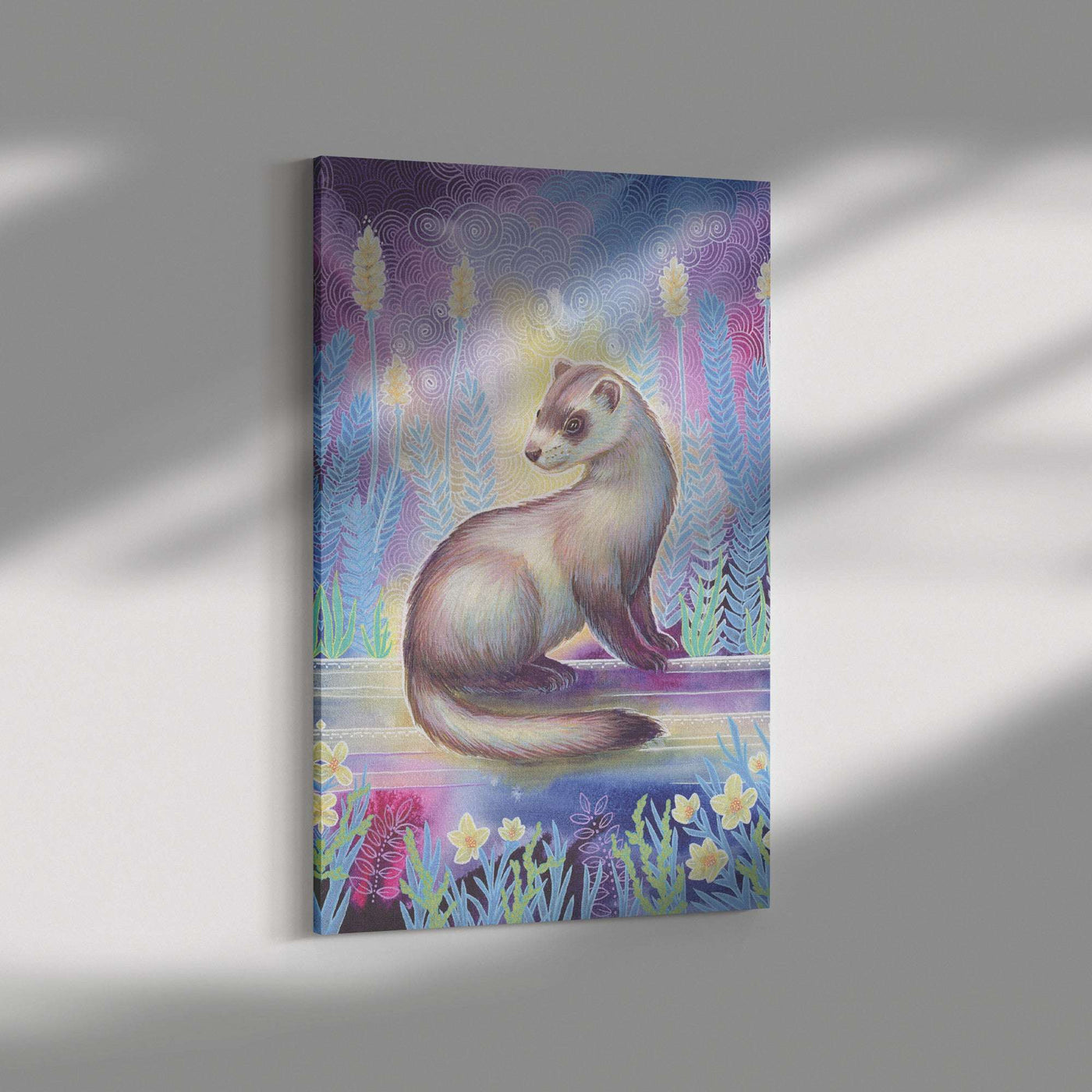 Canvas Art Print depicting a whimsical painting of a ferret amidst flowers with a colorful, patterned background, hung on a light grey wall with soft lighting.