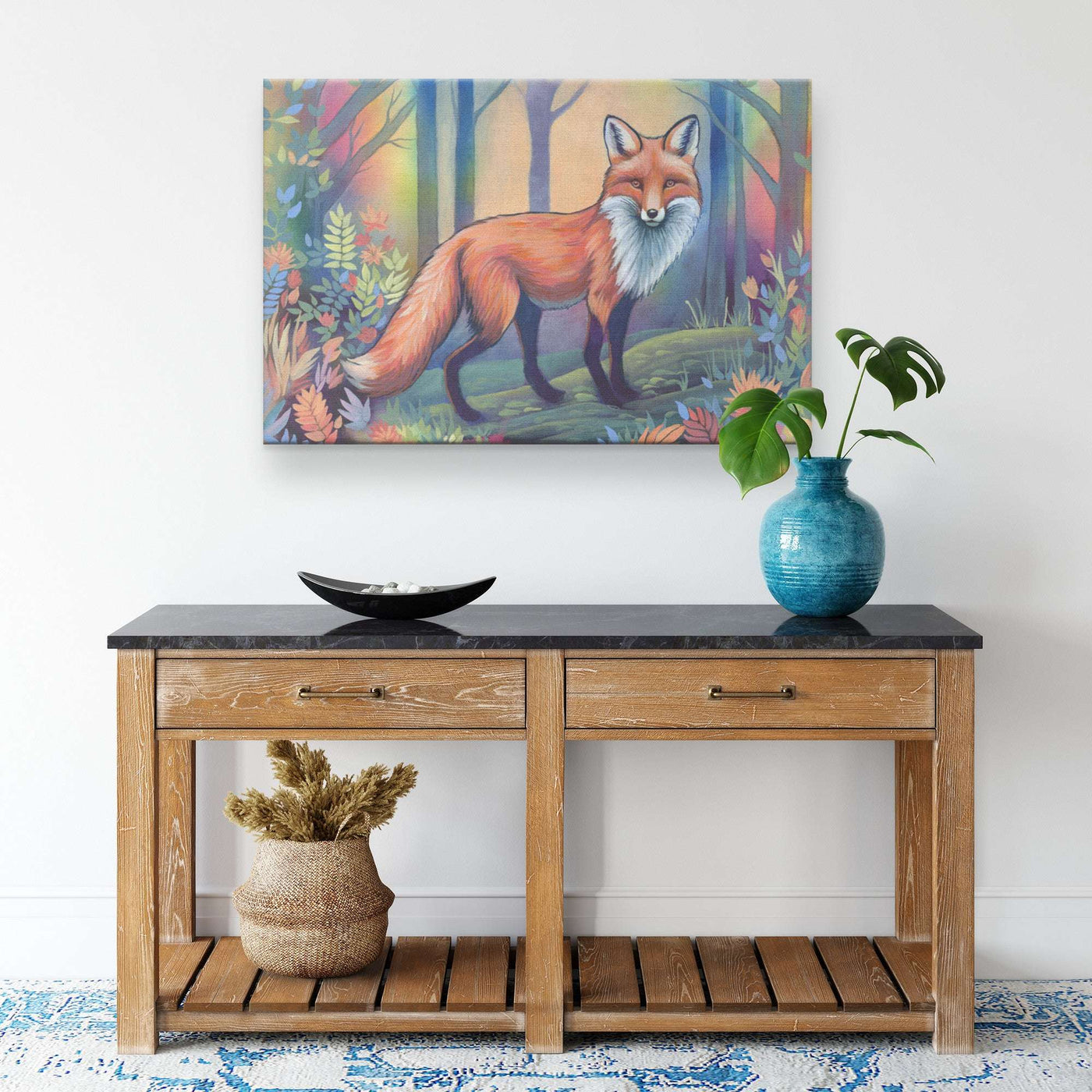 A wooden console table with a blue vase and green plant on top, set against a white wall featuring a Canvas Fox Print.