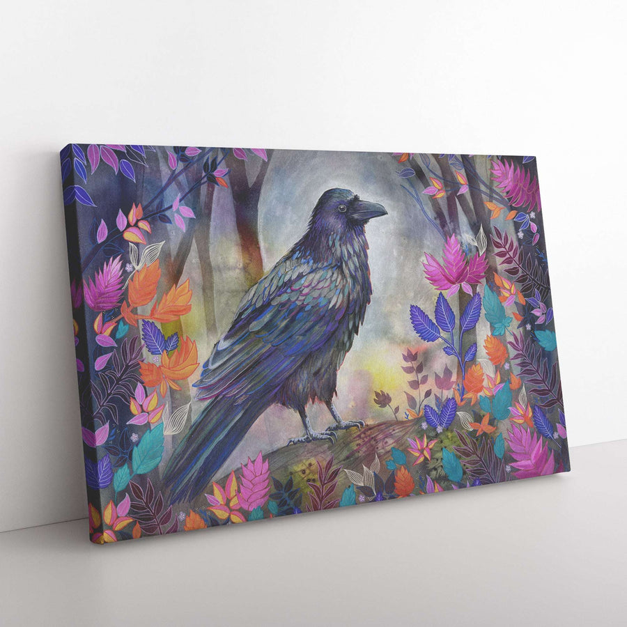 A Canvas Raven Print depicting a black raven perched on a branch surrounded by vibrant, multicolored leaves and flowers in a mystical forest setting.