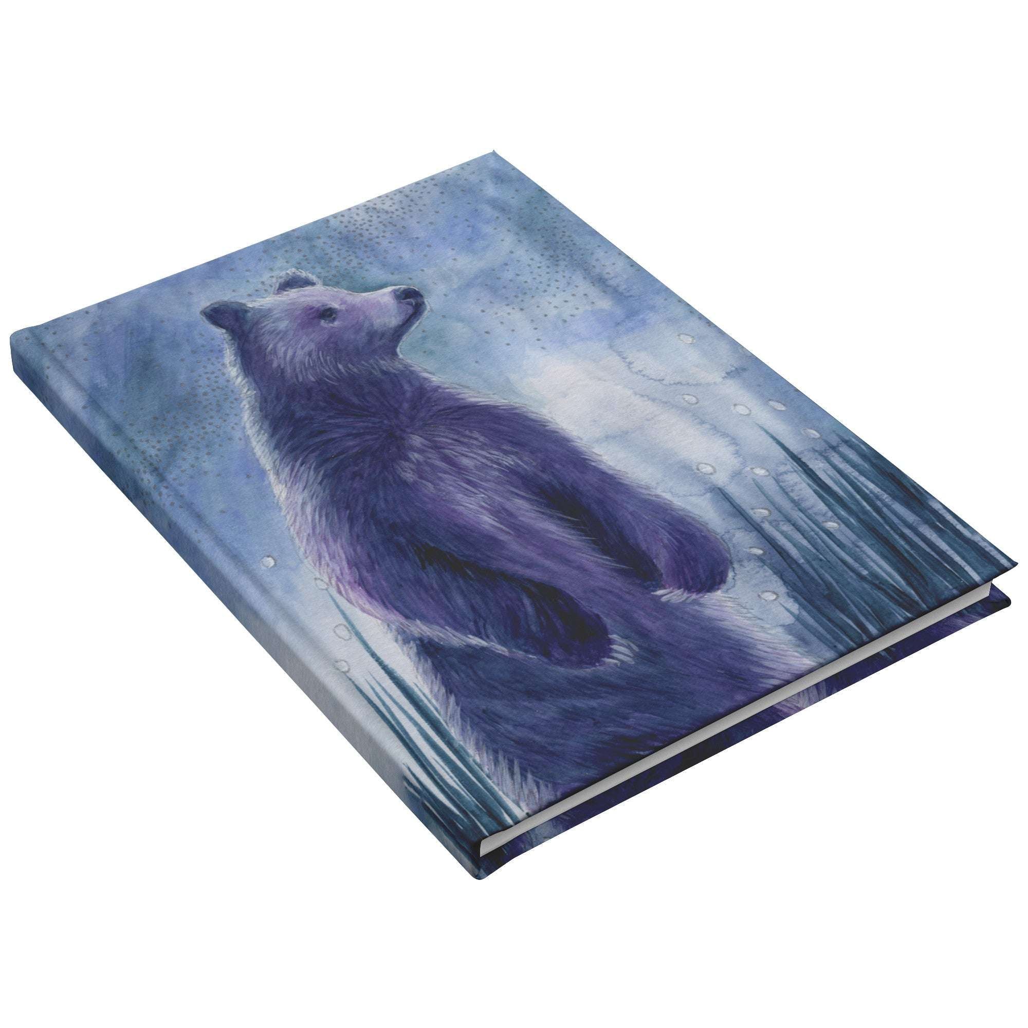 A Celestial Bear Journal featuring an illustration of a purple, whimsical bear standing in a blue, mystical forest setting.