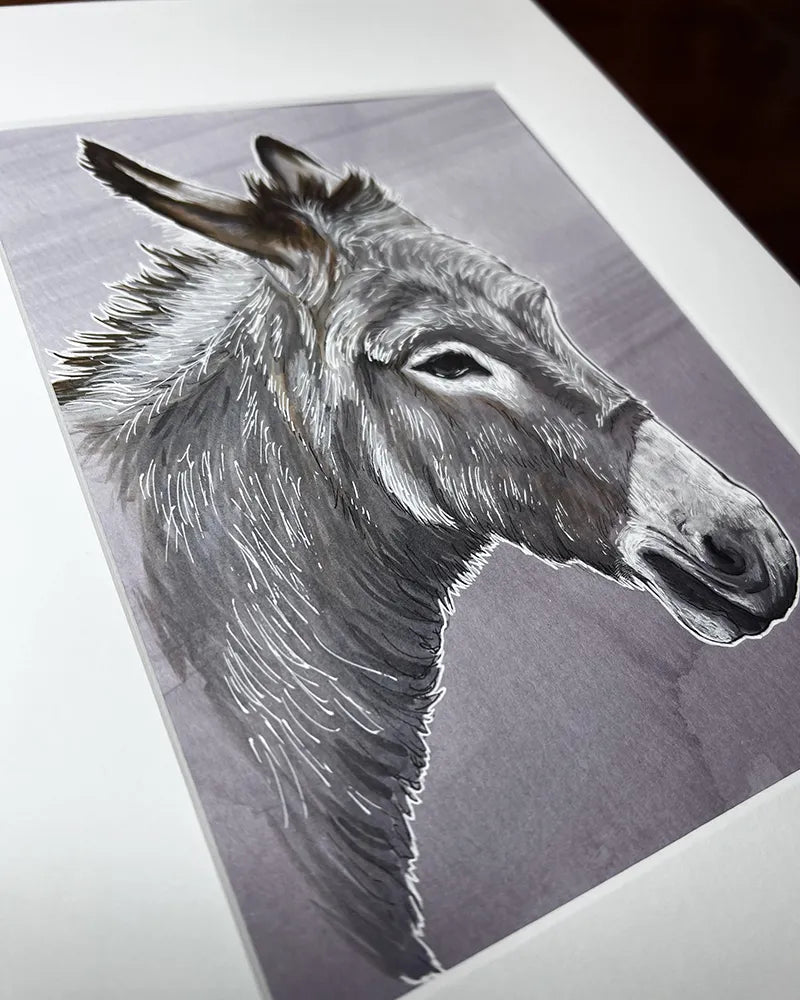 Angled view of a marker and pen donkey portrait highlighting the texture and penwork on the paper.