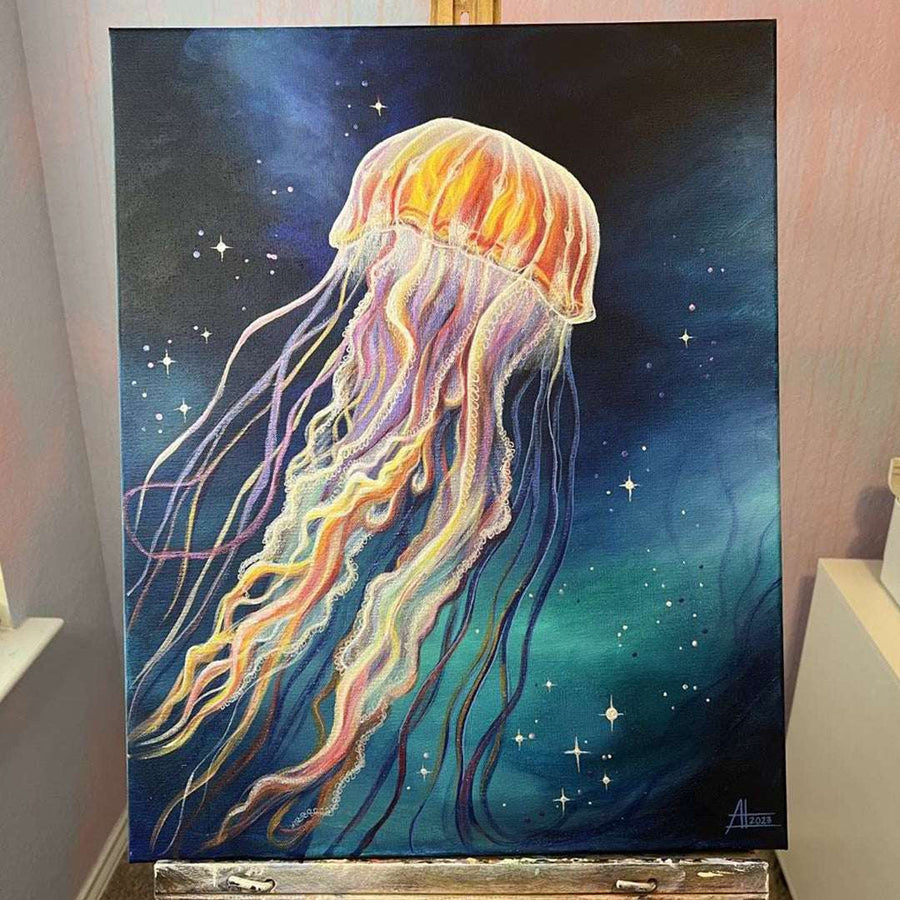 Jellyfish painting on easel showcasing vibrant colors and celestial background in an artist's studio.