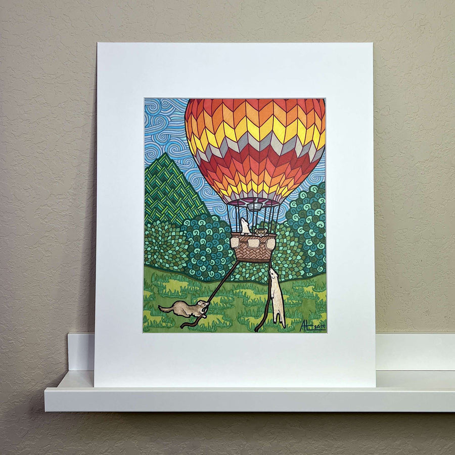 Illustrated marker artwork of a hot air balloon with ferrets on a white shelf against a neutral wall.
