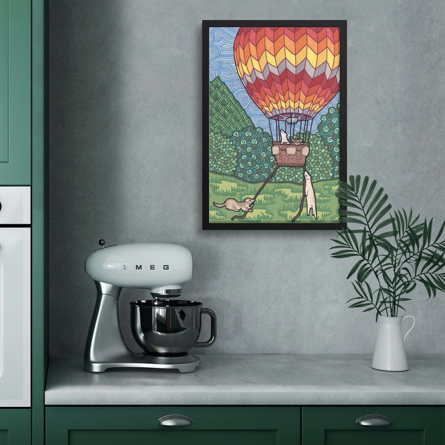 Modern kitchen with a vibrant Ferret Flight Framed Print on the wall, with ferrets in a colorful hot air balloon.