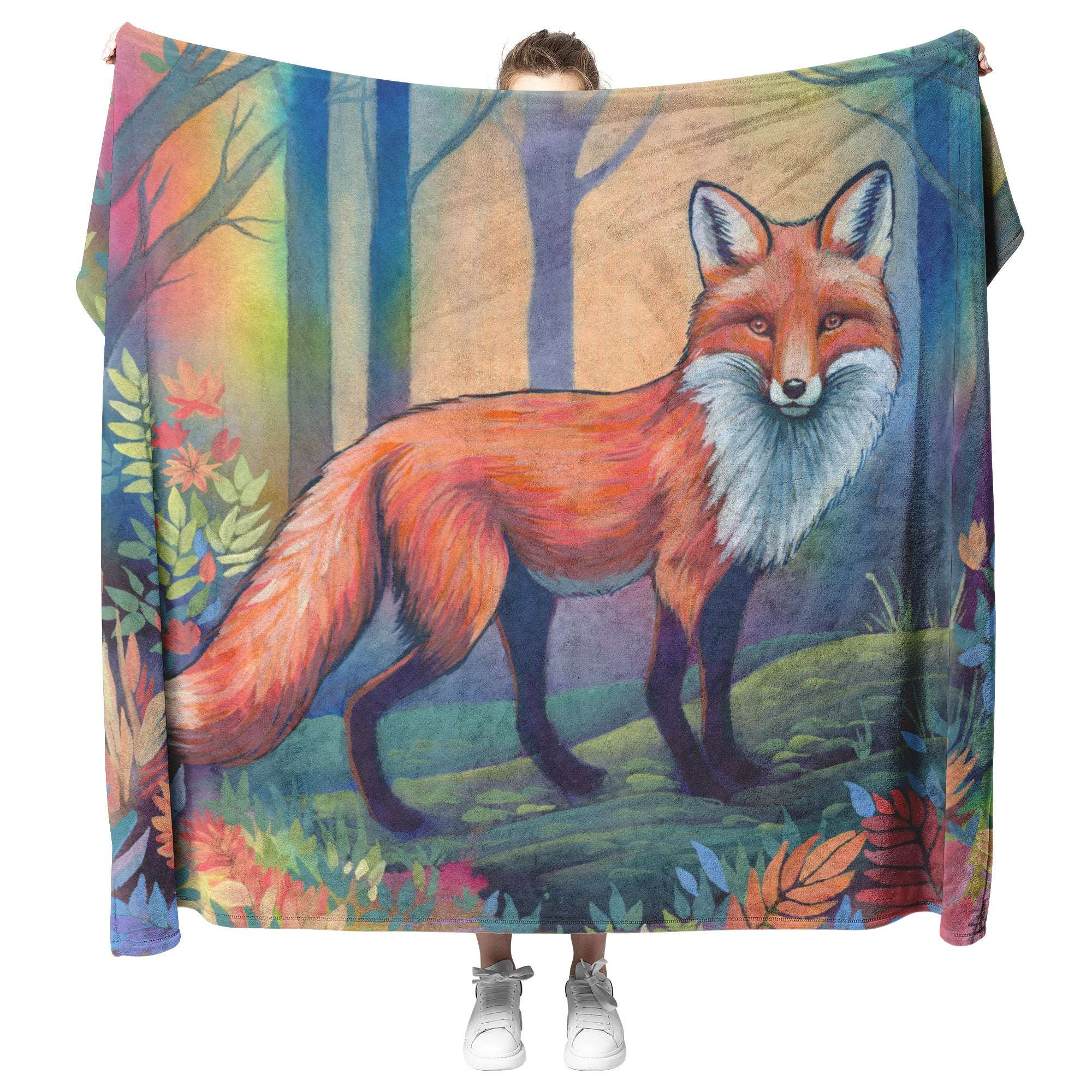 A person stands holding a large Fox Blanket featuring a vibrant painting of a red fox in a colorful forest scene.