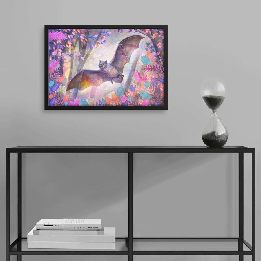 A colorful framed print of a bat painting in a lush, vibrant forest hangs above a modern table.