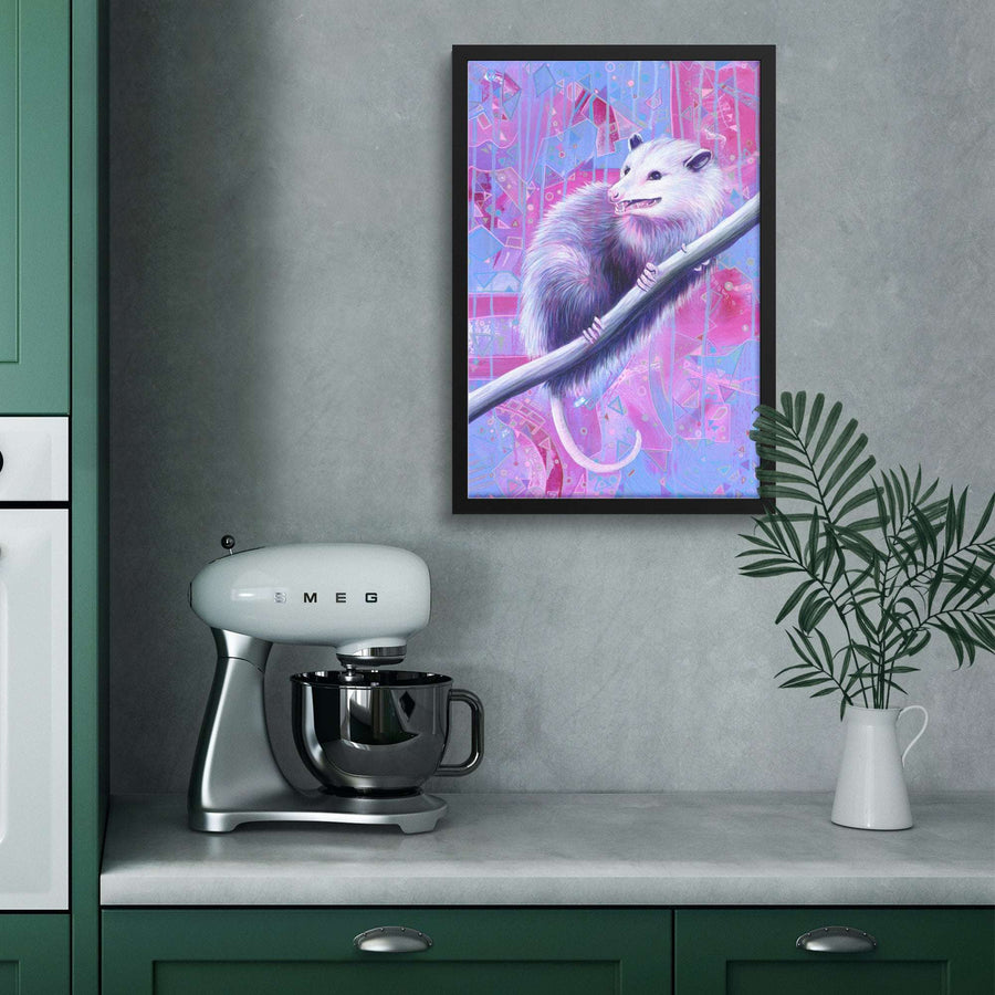 A vibrant framed opossum print adds whimsy to a sleek kitchen, contrasting the green cabinets and modern mixer with a pop of nature.