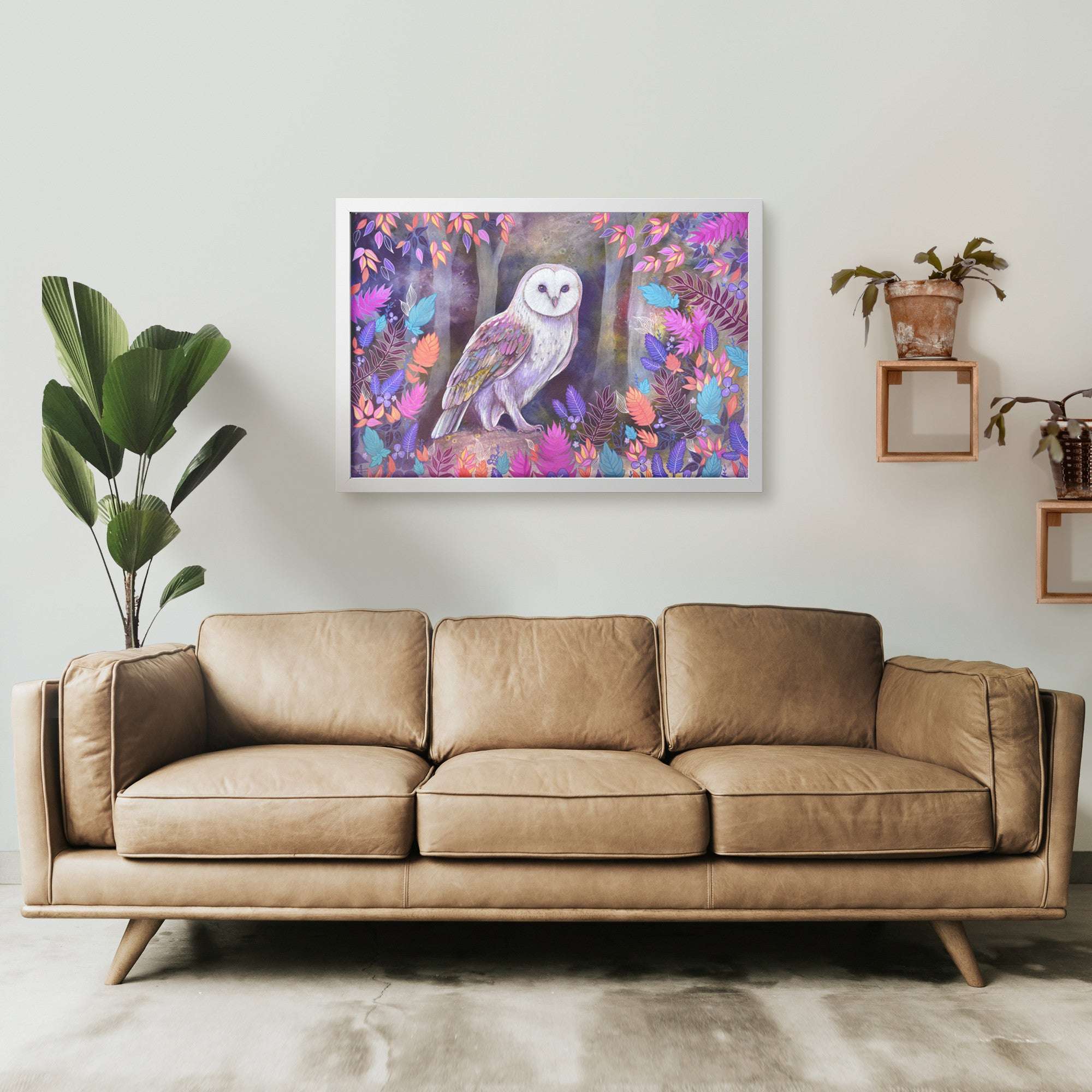 A modern living room, a colorful Framed Owl Art Print hangs on the wall
