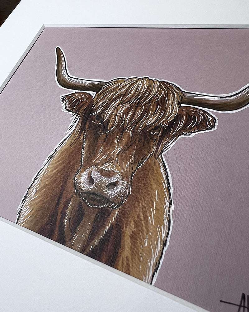 Close-up of a pen and marker Highland cow in a white mat frame.