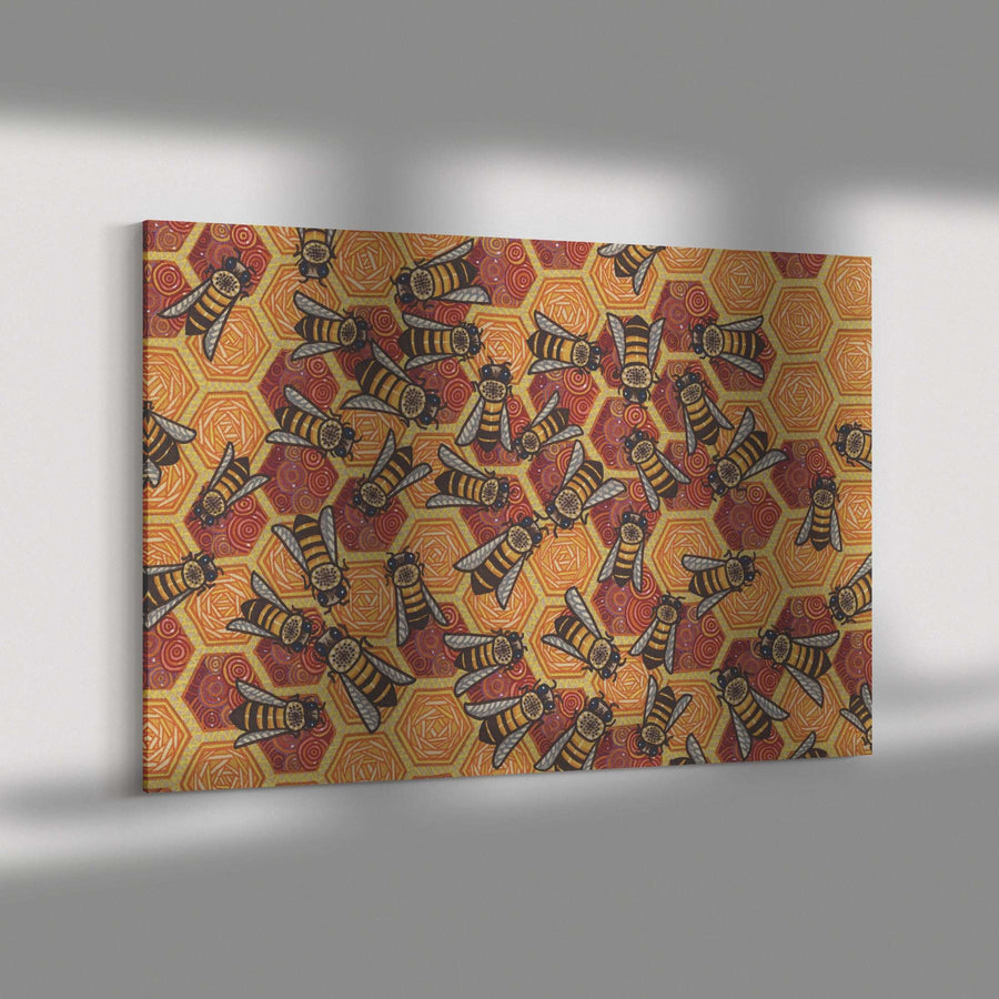 A colorful Honeycomb Harmony Canvas Print displaying a pattern of stylized bees on a textured, orange and red background, mounted on a gray wall.