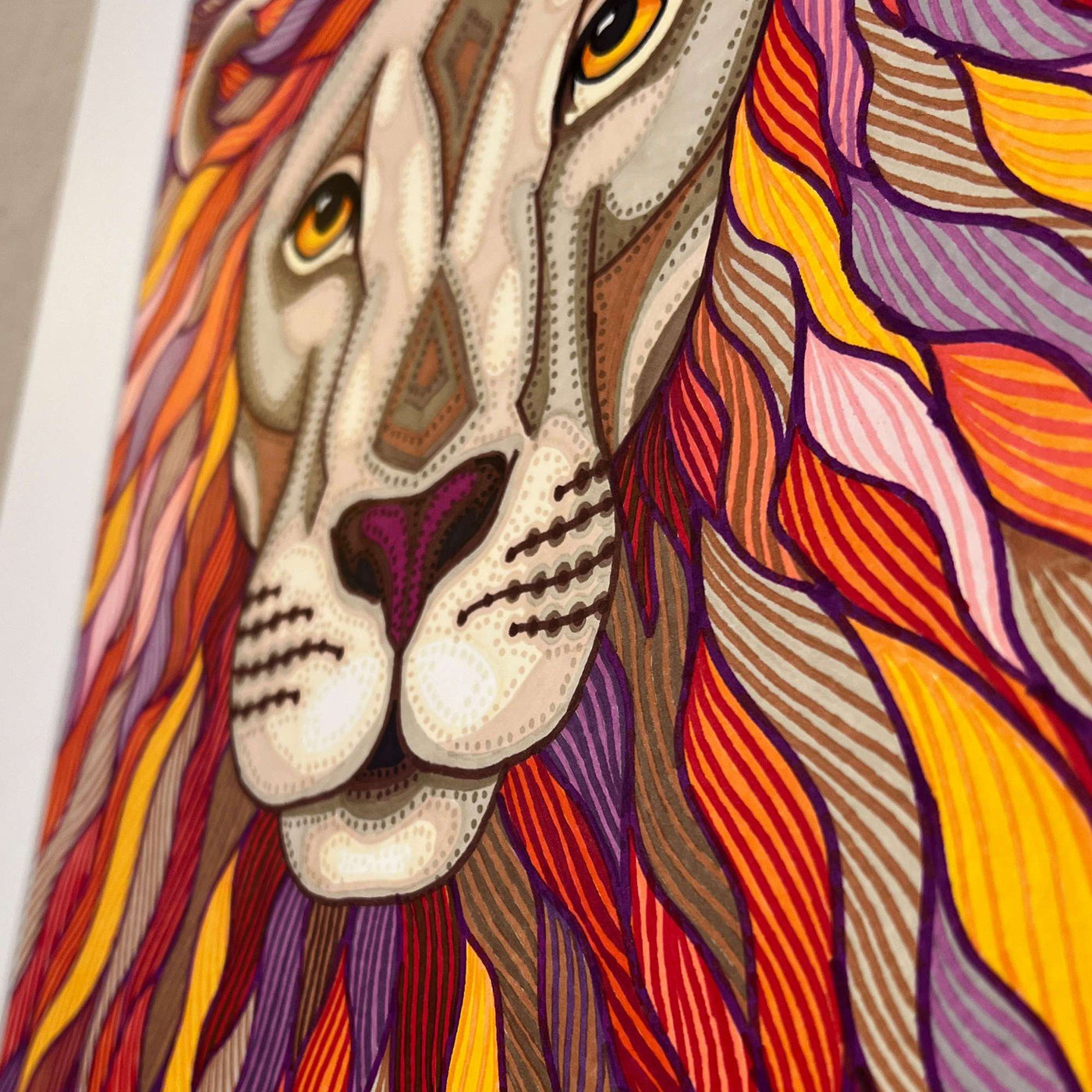 Close-up of a colorful, patterned lion face marker illustration