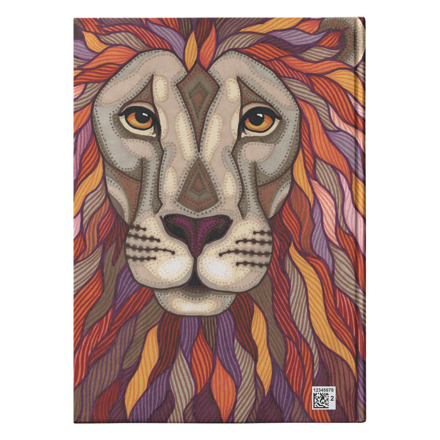 A hardcover journal, illustrated with a lion's face with intricate, colorful patterns and designs on a white background.