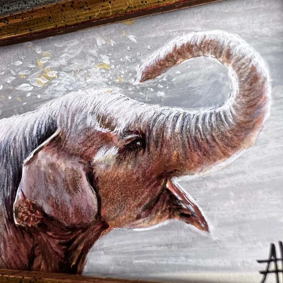 Close-up of small elephant painting capturing the texture of its skin and a playful trunk twist.