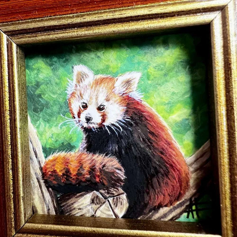 Close-up of a red panda painting with detailed fur texture and vibrant green backdrop.