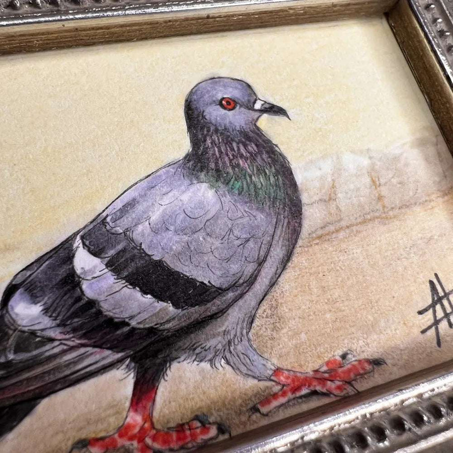 Close-up of a pigeon painting showing off the details in its feathers and eyes.