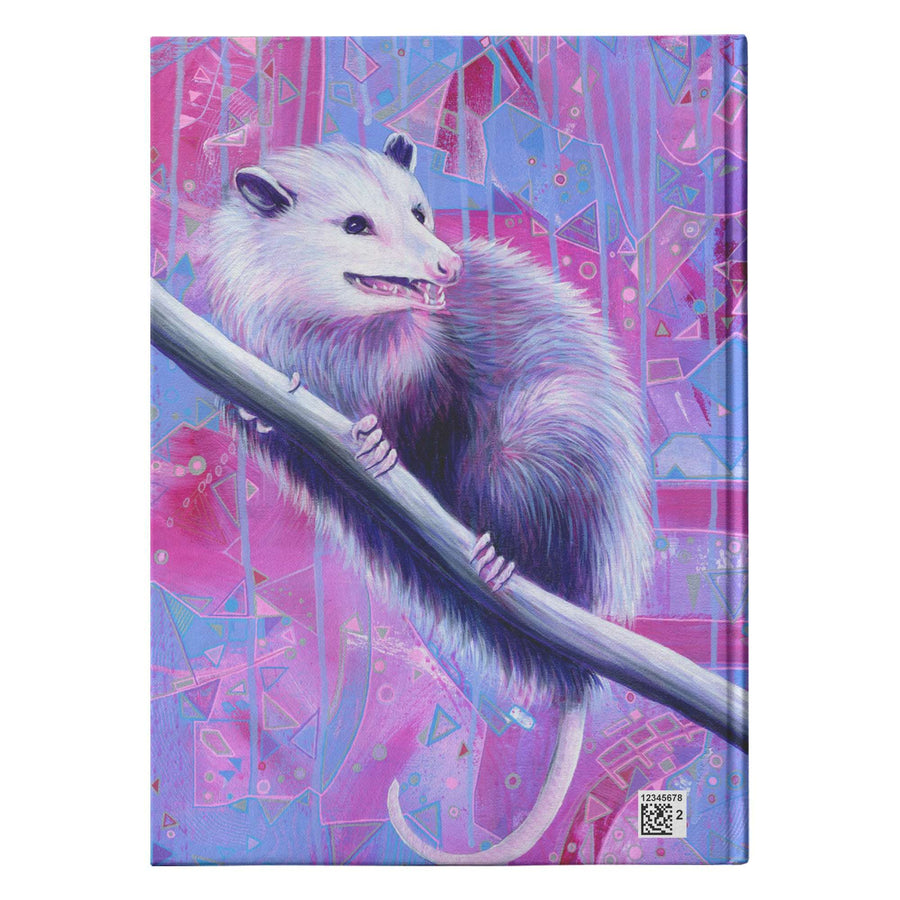 A colorful journal cover with a white opossum perched on a branch against a vibrant, geometric background in shades of purple and pink