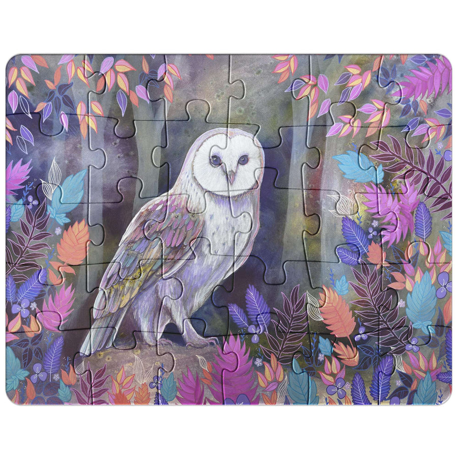 An Owl Puzzle depicting a white owl perched on a branch surrounded by colorful foliage.