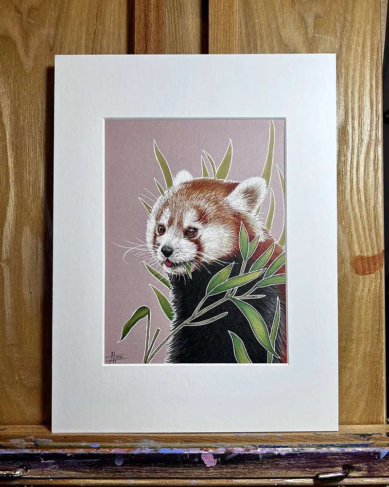 Illustration of a Red Panda - Original Marker Painting peering through green leaves, framed and displayed on a wooden easel.