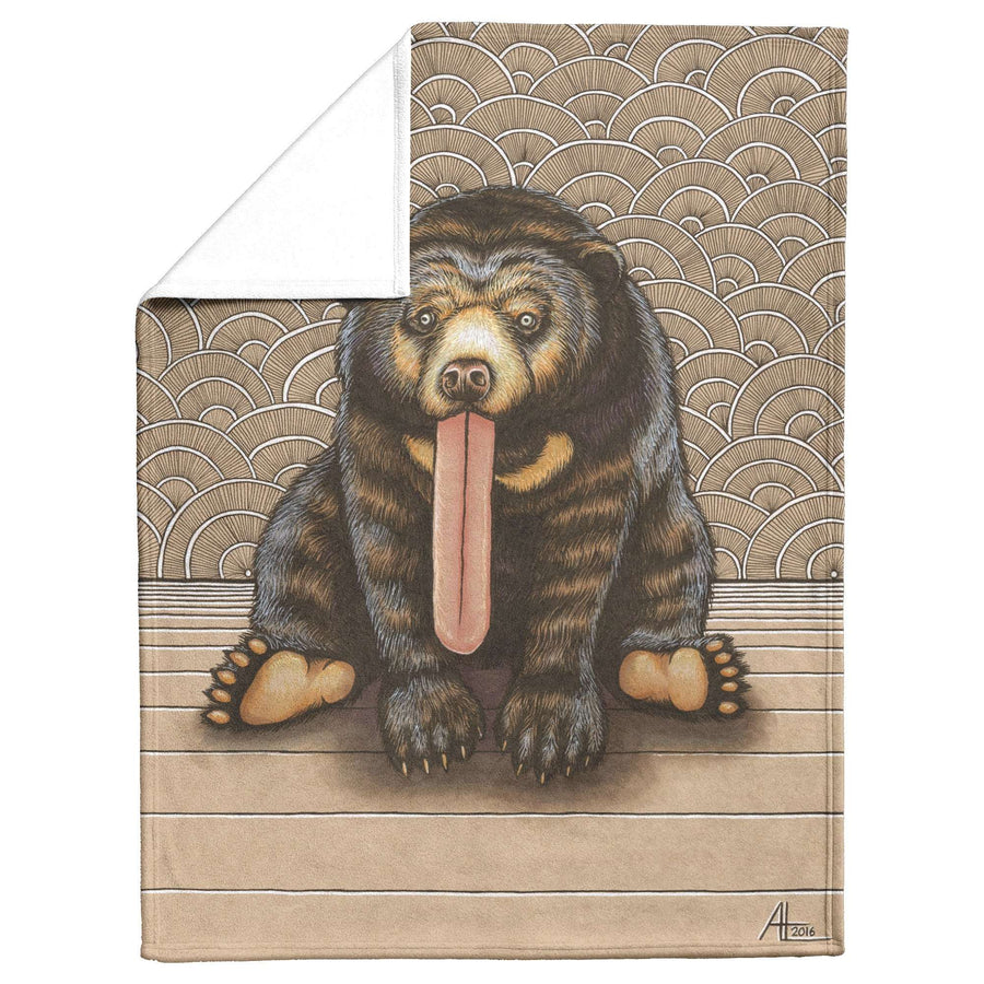 Illustration of a Sun Bear Blanket with an exaggeratedly long tongue sitting on a wooden floor, with a patterned background resembling waves.