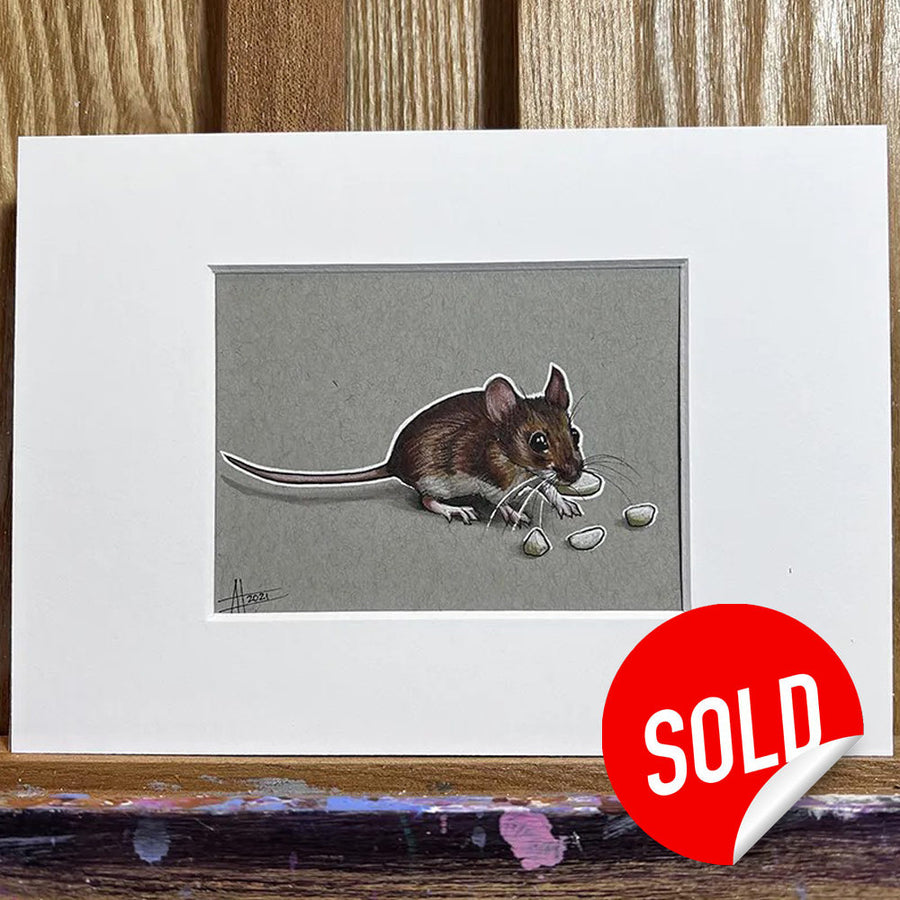 Pen and marker drawing of a Tiny Mouse with seeds, framed and leaning against a wooden easel, marked with a red "sold" sticker.