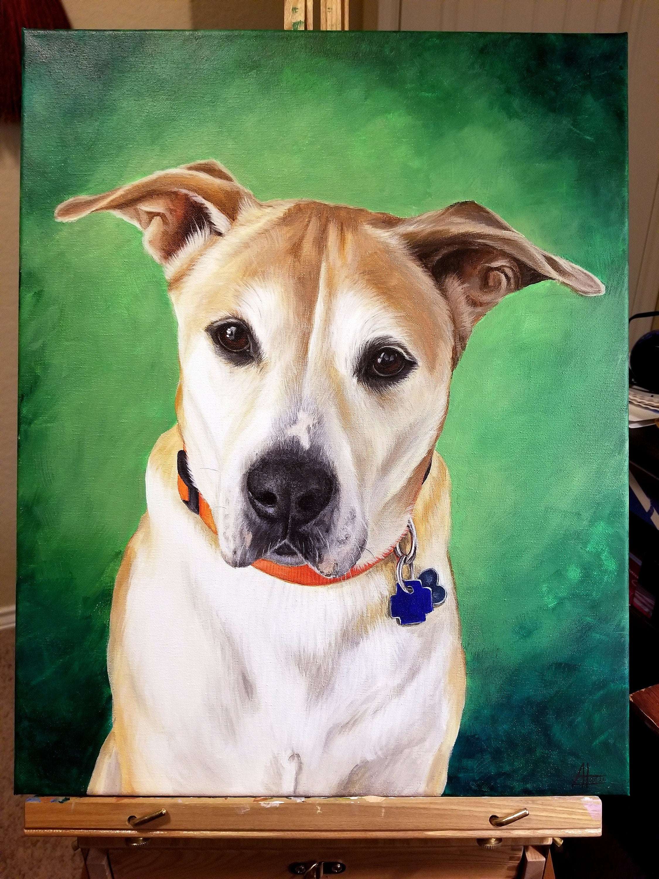 Pet portrait of a brown and white dog with an orange collar, against a green backdrop, on a wooden easel.