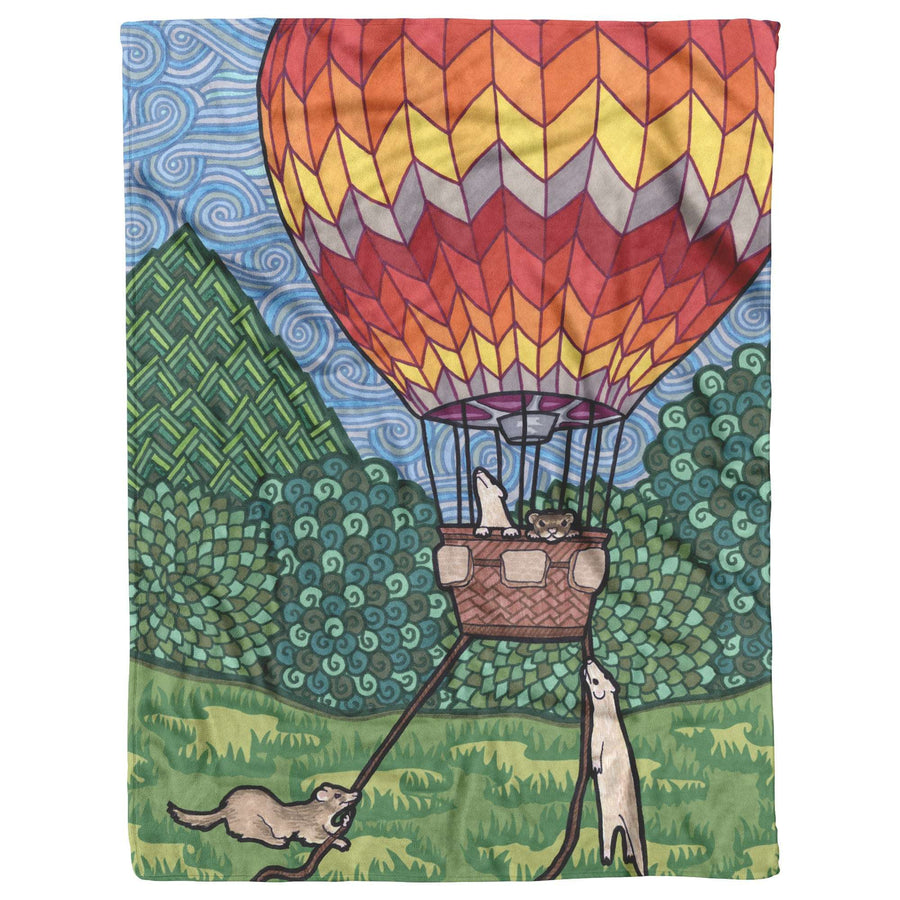 Illustration of a Ferret Blanket with ferrets in the hot air balloon basket, floating above a green landscape with colorful patterns.