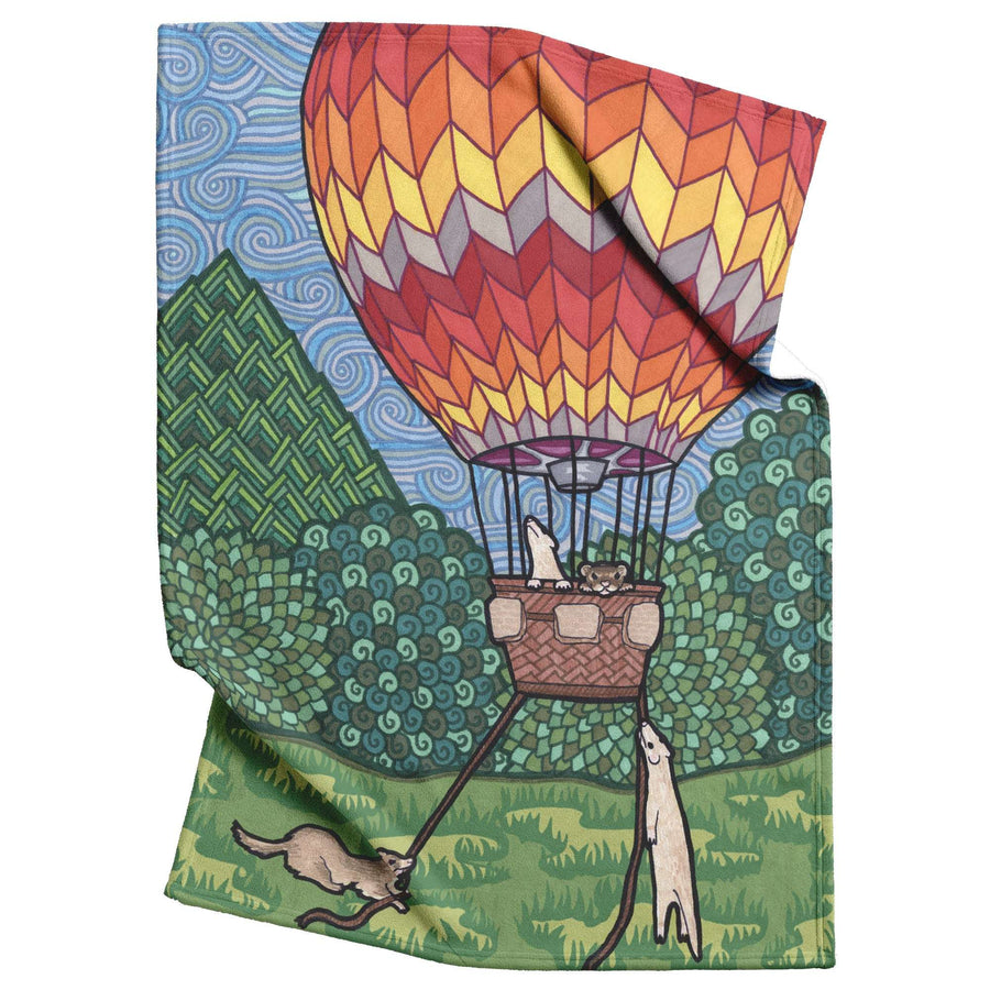 Ferret Blanket with an illustration of ferrets riding in a hot air balloon.