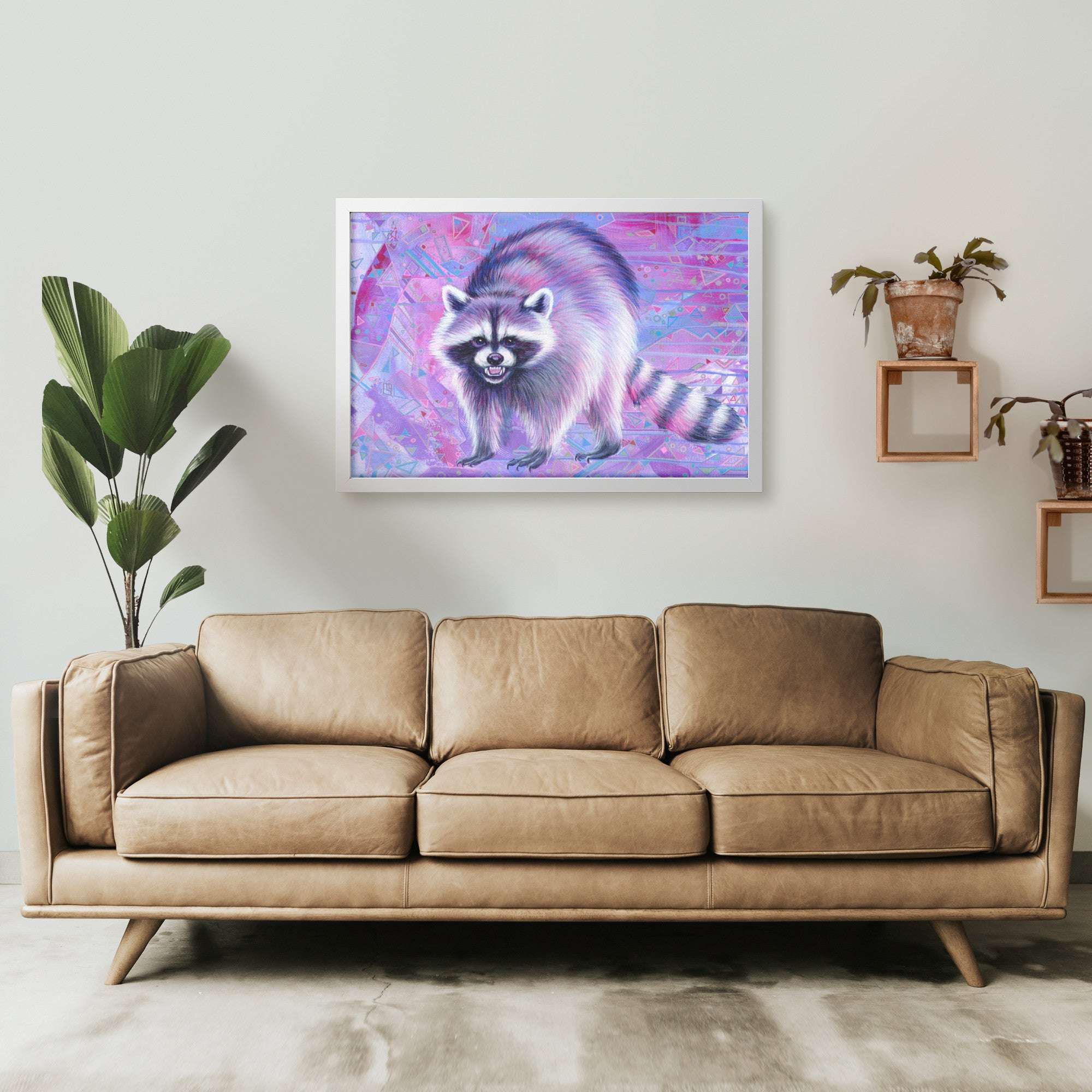 Vibrant Framed Raccoon Art Print hangs above a sofa in a modern living room.