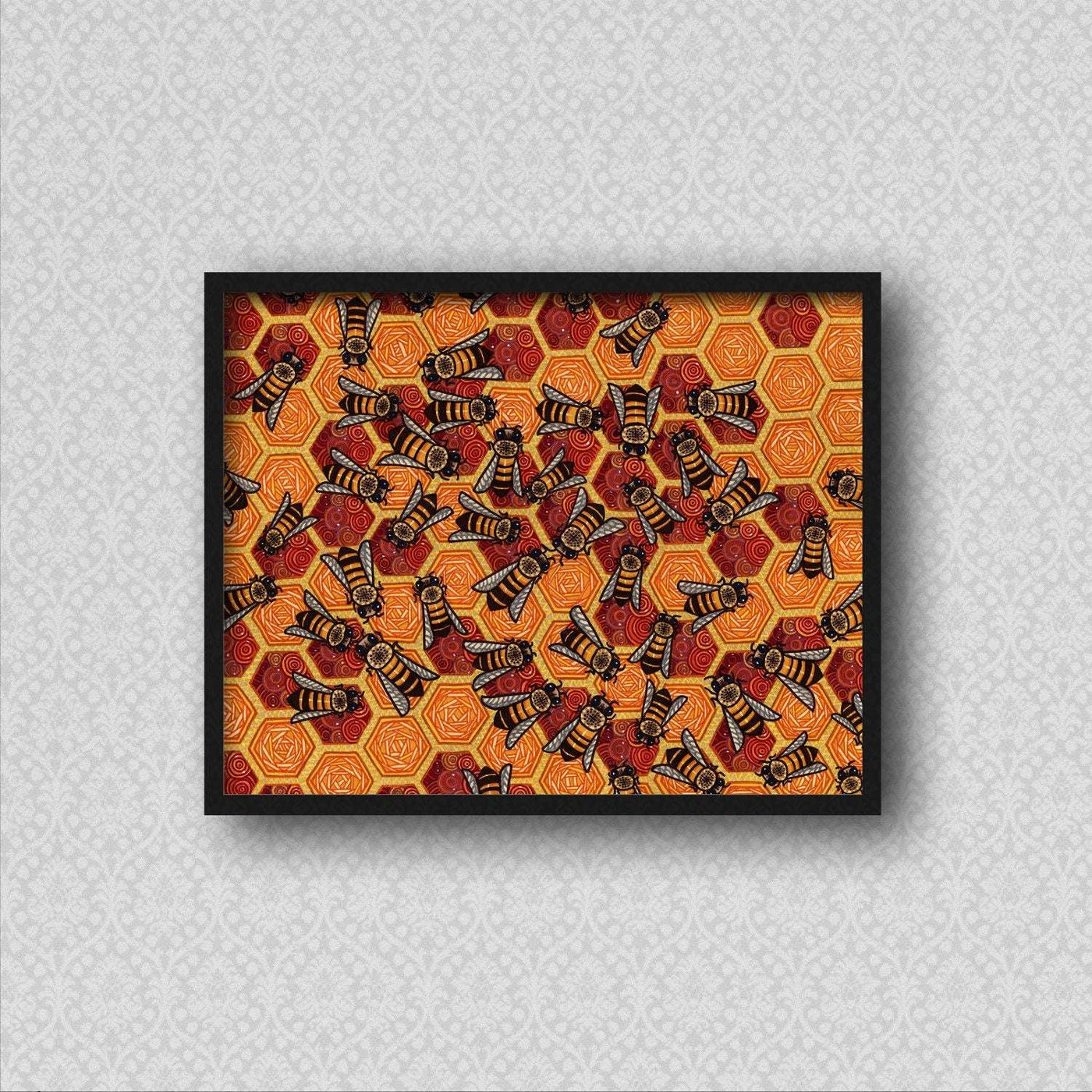 Framed print of honeycomb pattern with bees on a wall