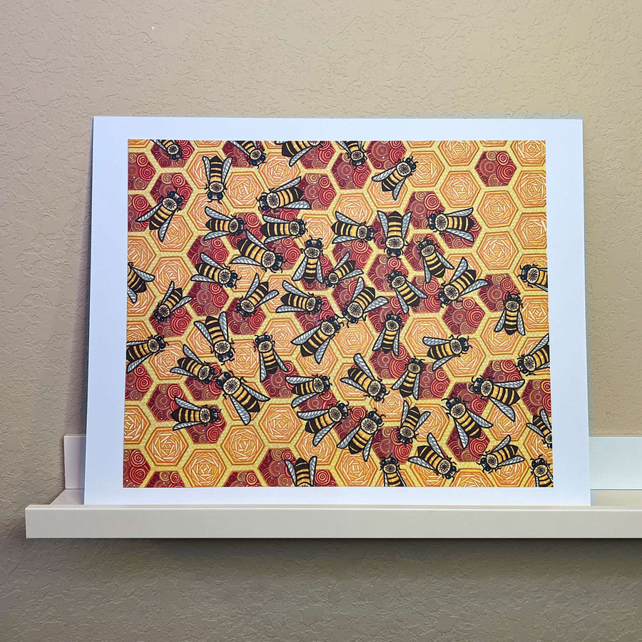 Original marker artwork of bees on honeycomb pattern displayed on a white ledge.