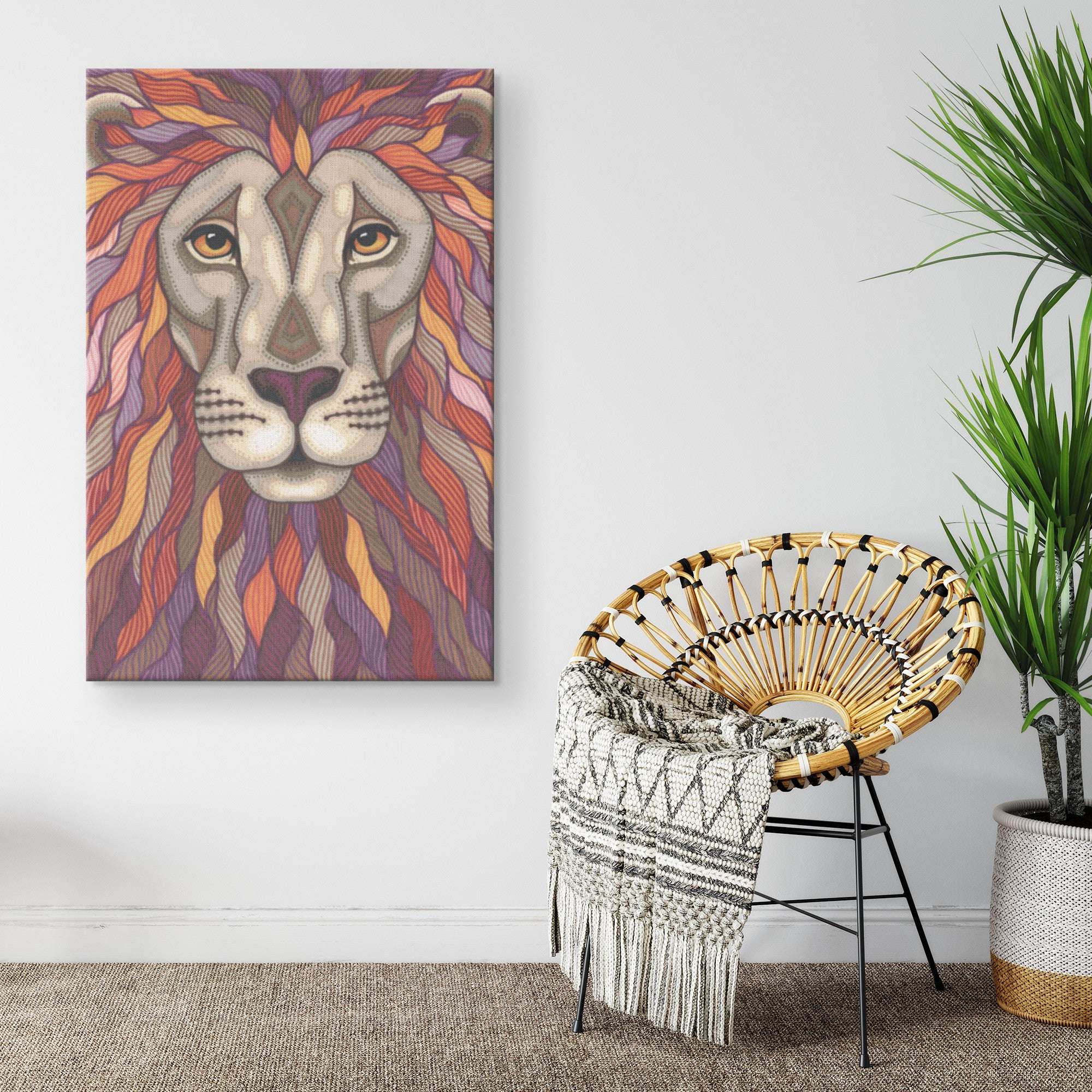 Colorful Lion Pride Canvas Print hanging on a wall next to a stylish woven chair with a blanket, placed in a modern room with a green potted plant.