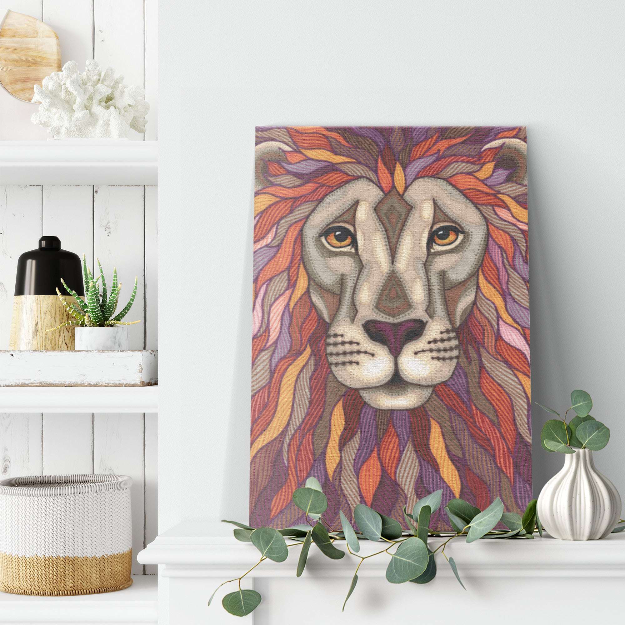 A Lion Pride Canvas Print hangs on a white wall above a shelf with decorative items and plants.