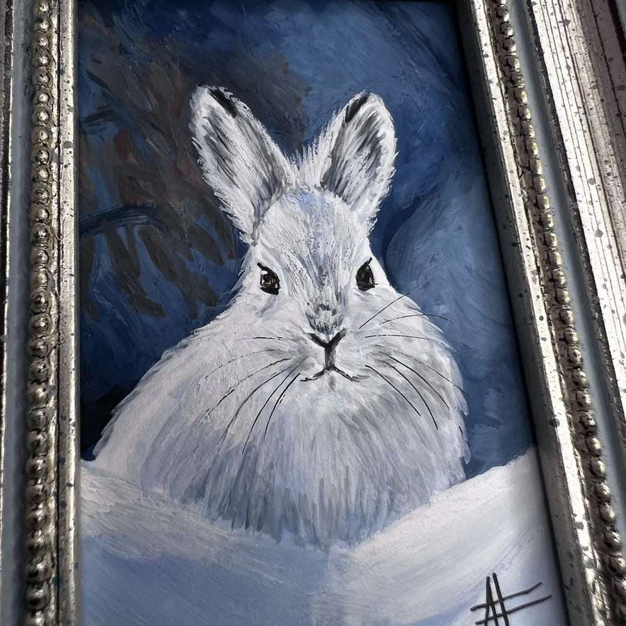 Close-up of snow rabbit painting highlighting soft fur detail and bright eyes.