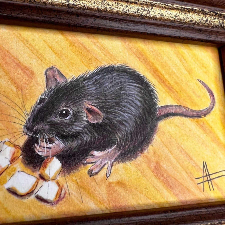 Close-up of the black rat painting highlighting its whiskers and held marshmallows.