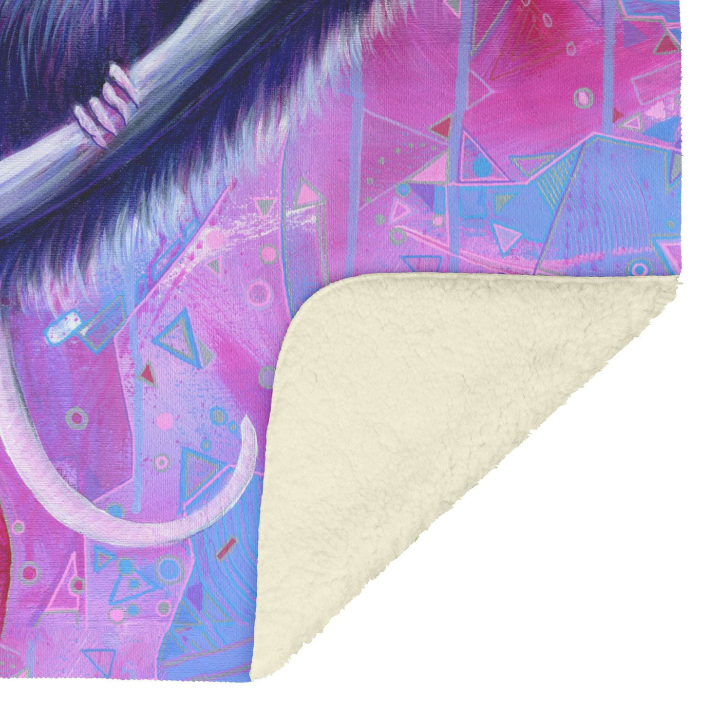 A close-up view of the folded fleece corner of the Opossum blanket, showcasing colorful abstract art featuring geometric shapes in pink and purple.