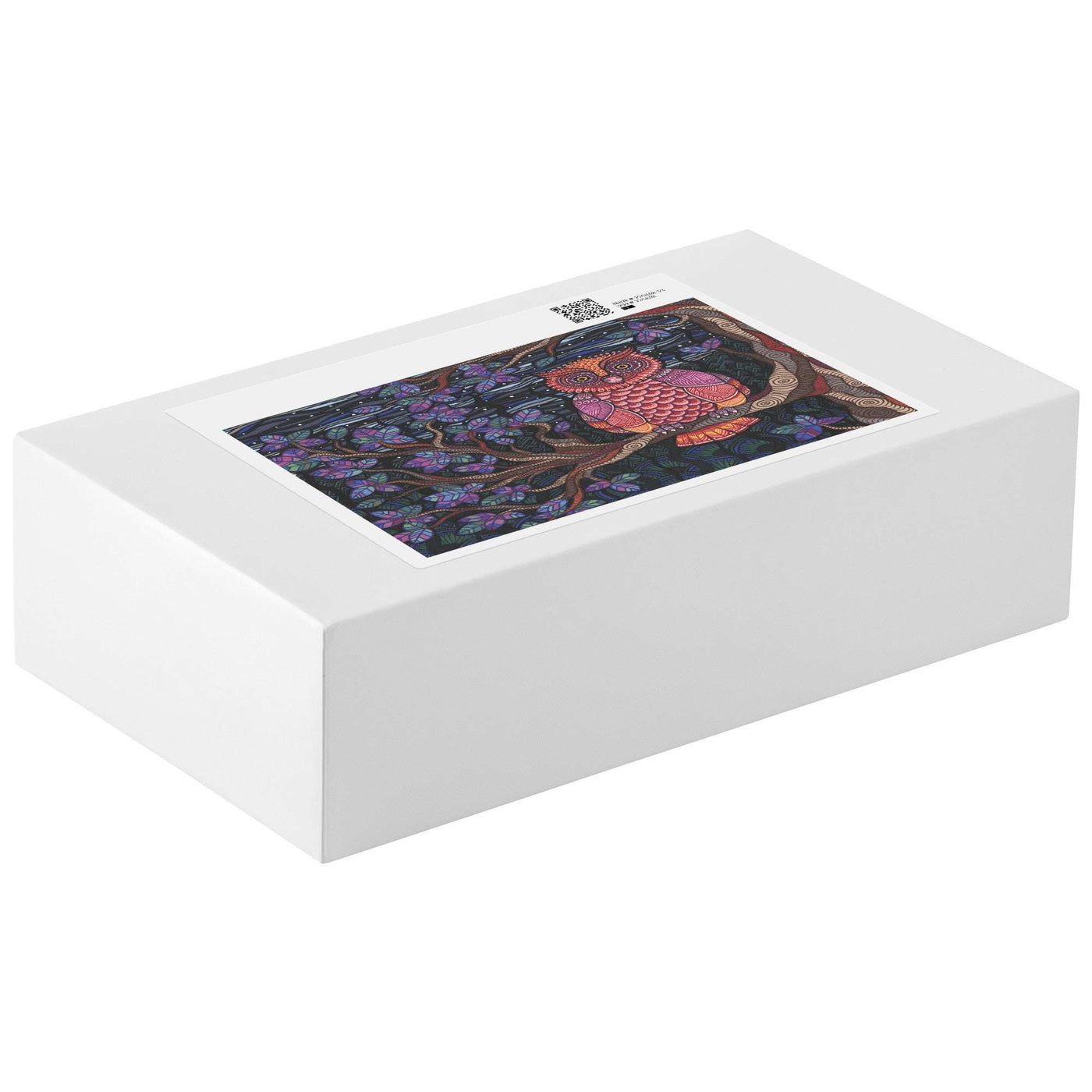 A white rectangular Owl Tree Puzzle box with a label on the lid showing a colorful pattern.