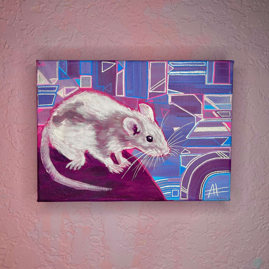 A small painting of a white rat on a colorful geometric patterned background, displayed on a textured pink wall.
