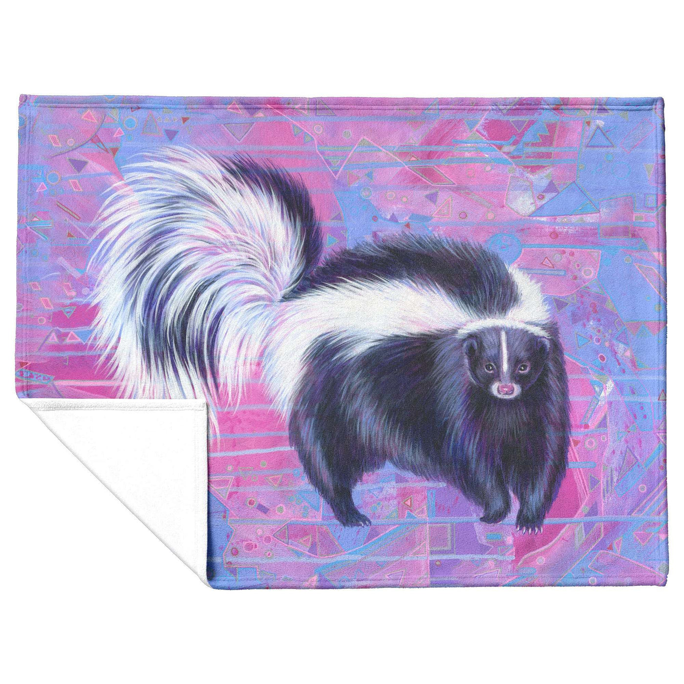 A fleece blanket with a colorful illustration of a skunk on a pink and blue geometric background