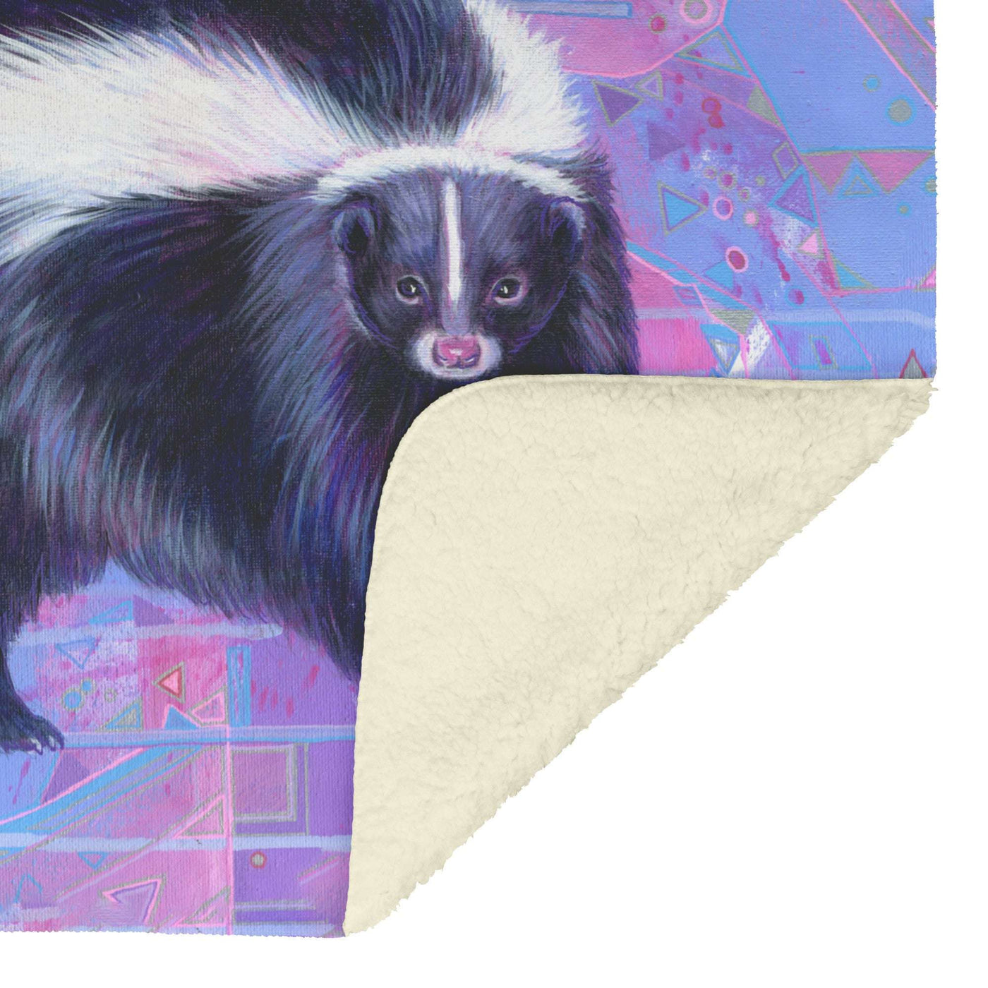 A Skunk Blanket illustrated with vibrant and detailed textures against a colorful geometric background, partially hidden behind the folded corner of the fleece blanket