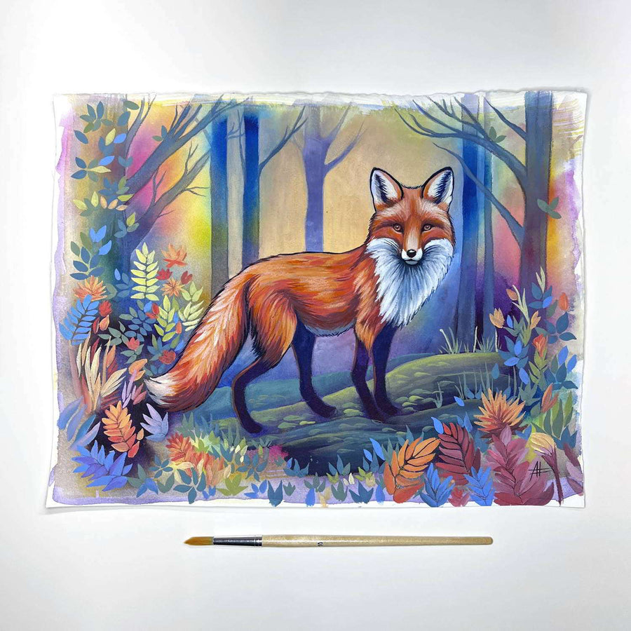 A painting of a fox surrounded by a flurry of autumn leaves and twilight hues, with a paintbrush for scale.