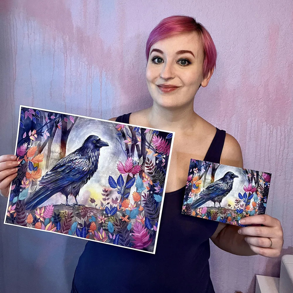 Woman with pink hair holding a large and a small painting of "The Raven (Night Flight)" surrounded by colorful flowers.
