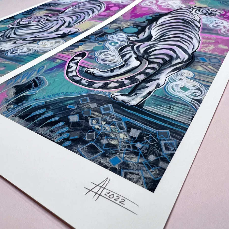 A series of vibrant, abstract Year of the Tiger Pair prints on paper with intricate patterns and a signature dated 2022 in the foreground.